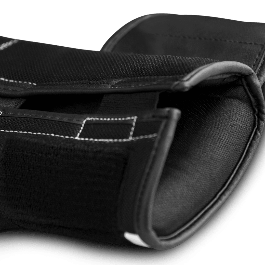 Close-up of the single hook and loop closure of the white Hayabusa S4 glove