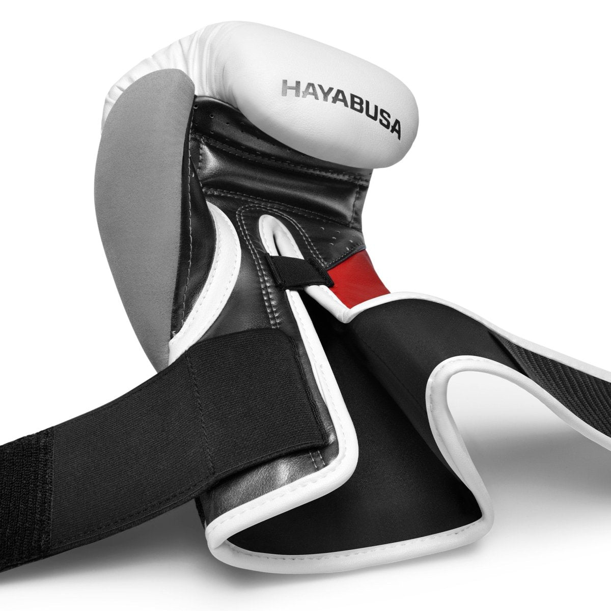 Open scheursluiting van de witte en rode handschoenen.