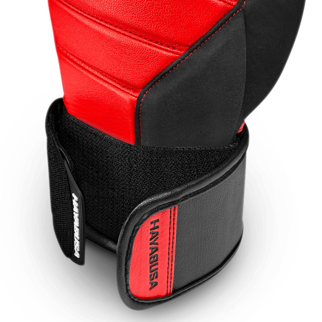Zicht op de Dual-X sluiting van de rode en zwarte handschoenen