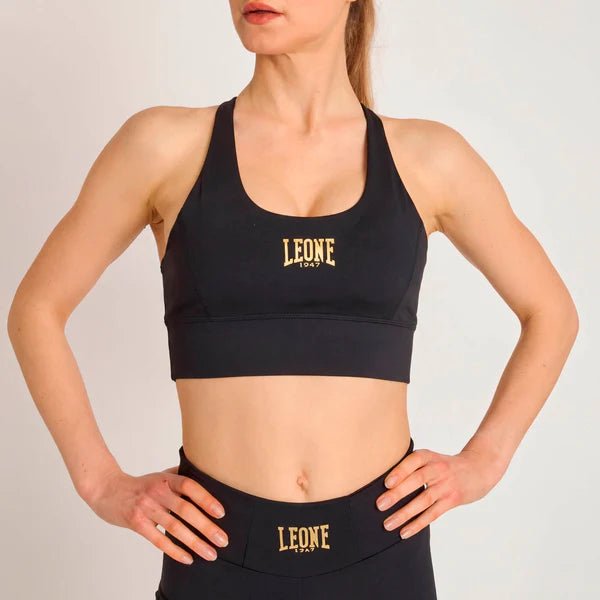 Vedere frontală a topului sport negru Leone DNA cu o potrivire compresivă