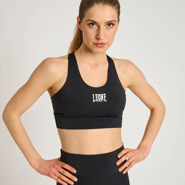 Vooraanzicht van de technische sporttop Leone Stripe 47 in zwart met driekleurige graphics