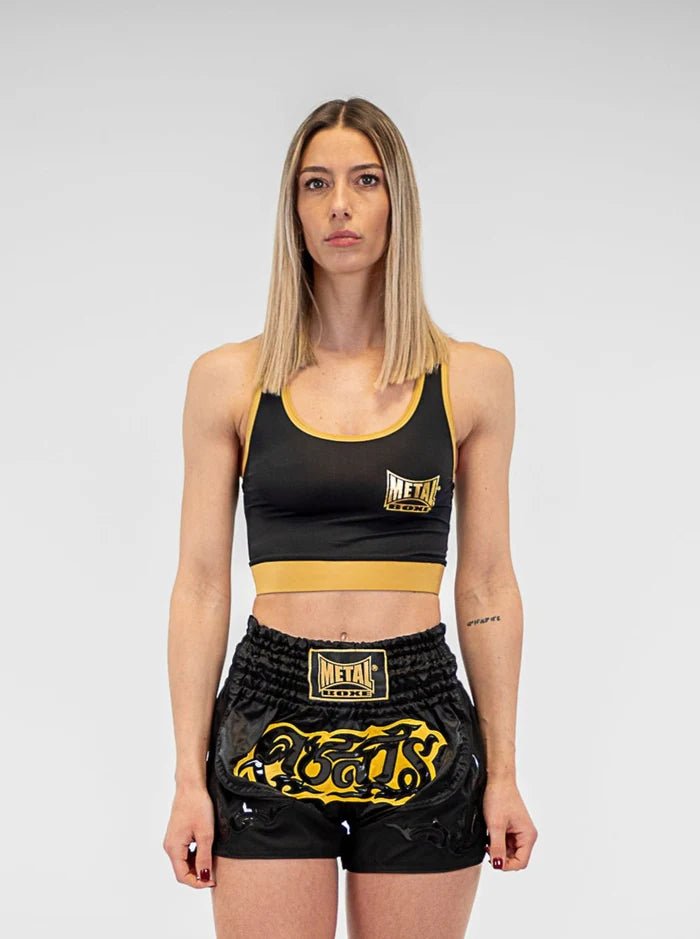 Vue de face haut de sport de boxe en métal noir et or en lycra pour l'entraînement