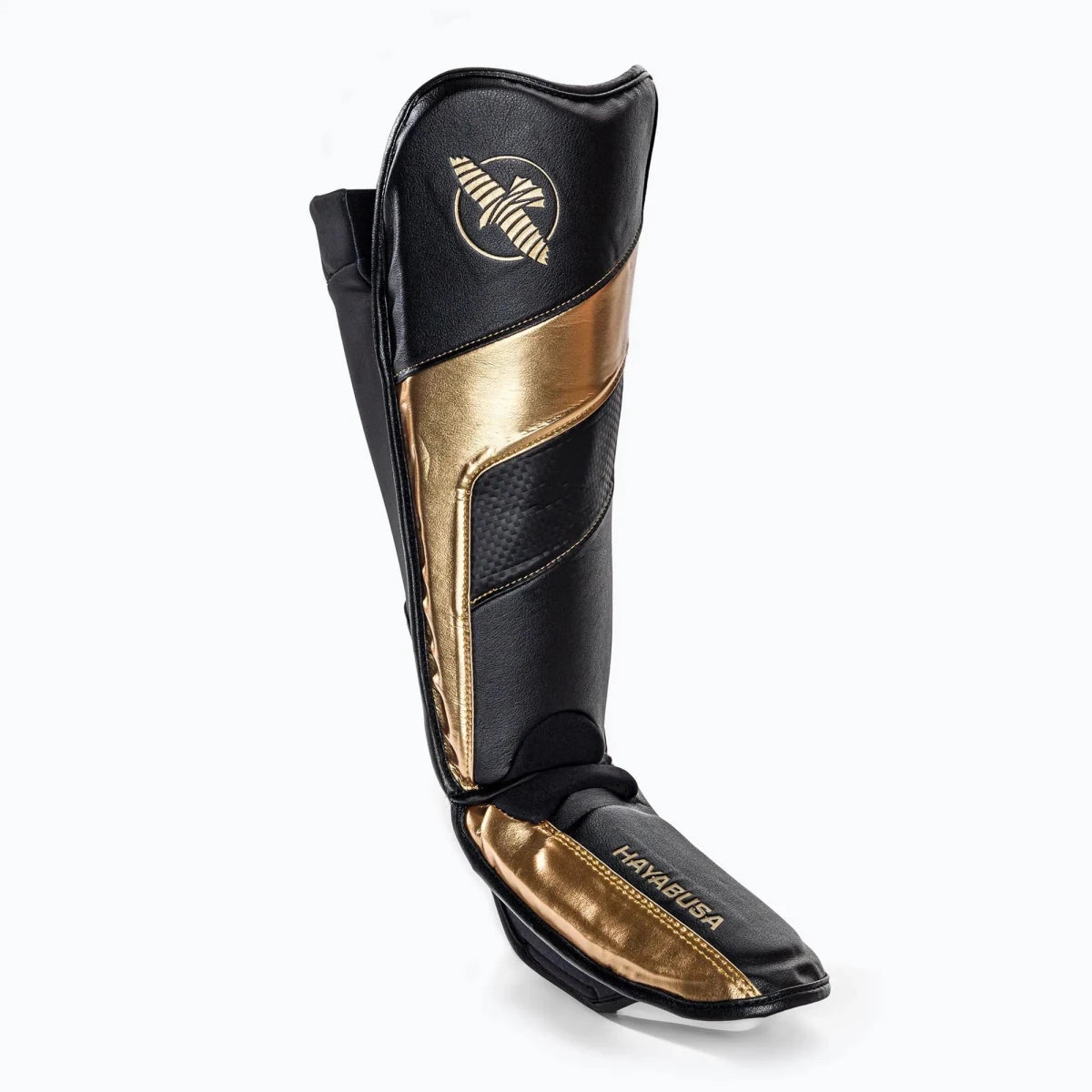 Vue latérale des protège-tibias chaussettes Hayabusa T3 en or noir montrant le profil fin et ergonomique.