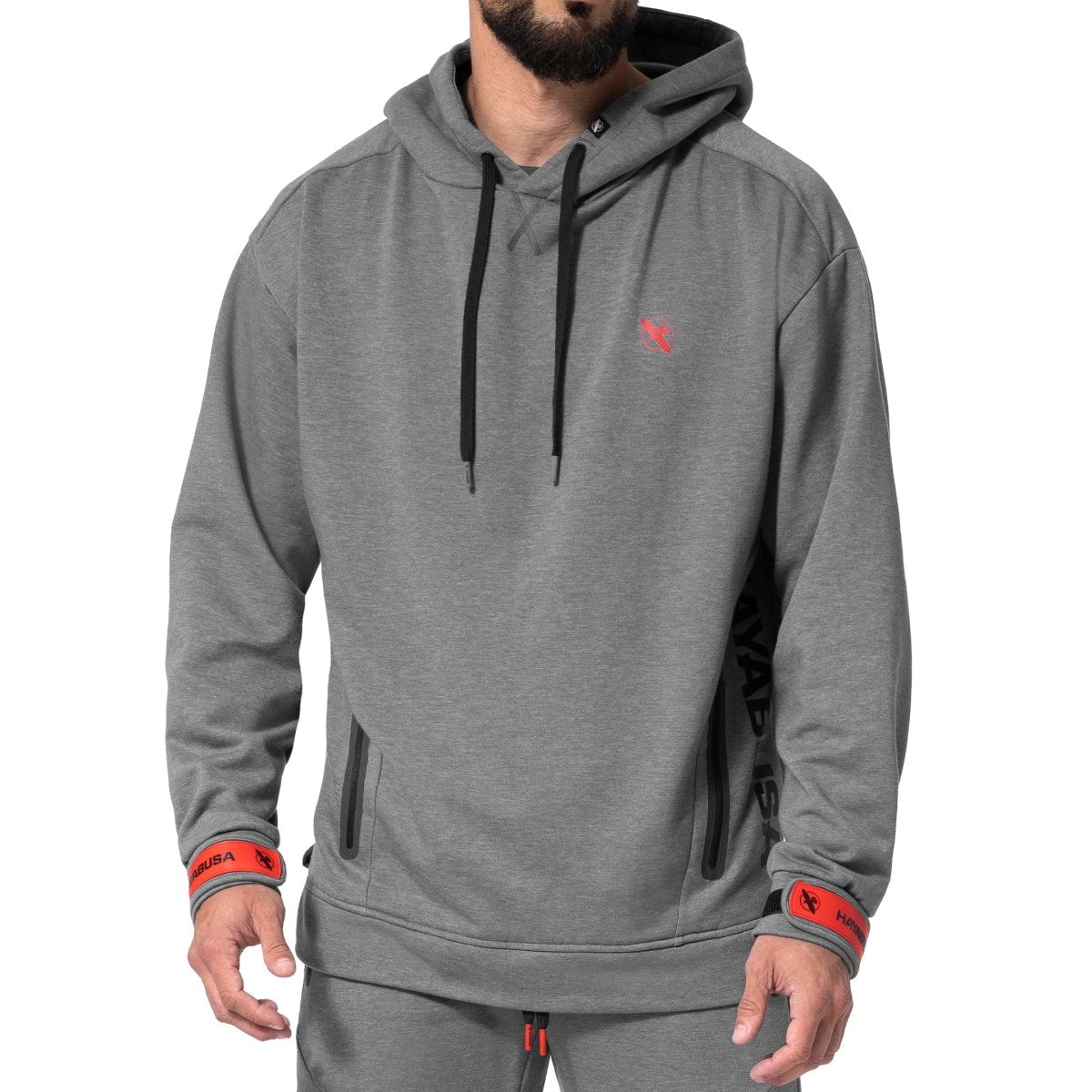 Framifrån av den mörkgrå melerade Hayabusa Midweight Pullover hoodie, med justerbara muddar och tekniska fickor