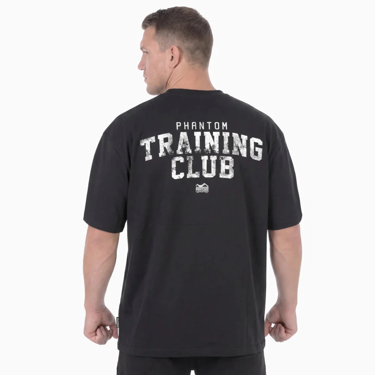 Vue arrière du t-shirt Phantom noir oversize avec le grand graphisme Training Club dans le dos