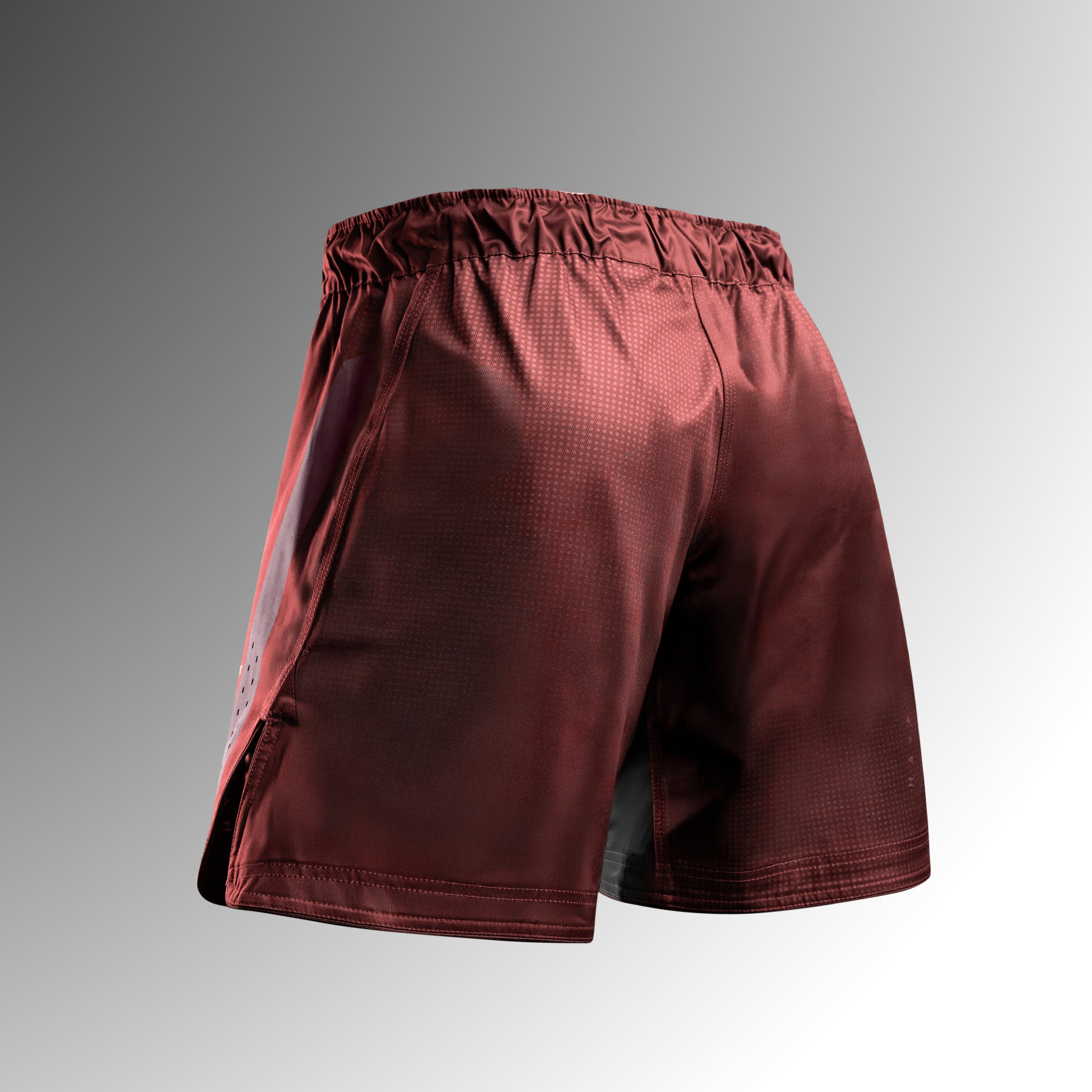 Vista posteriore dei pantaloncini MMA Hayabusa Core Mid-Thigh rossi in tessuto antistrappo per No-Gi